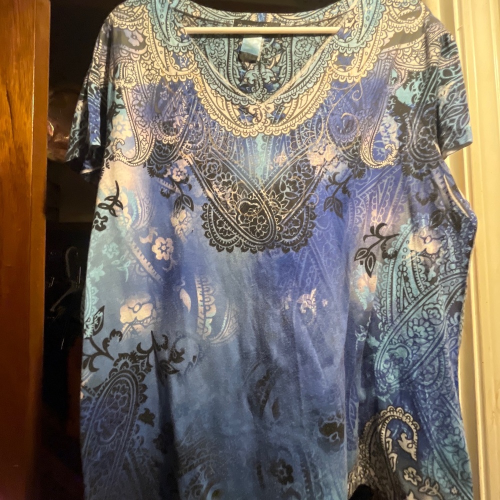 Blue, black, and white V neck shirt with short sleeves